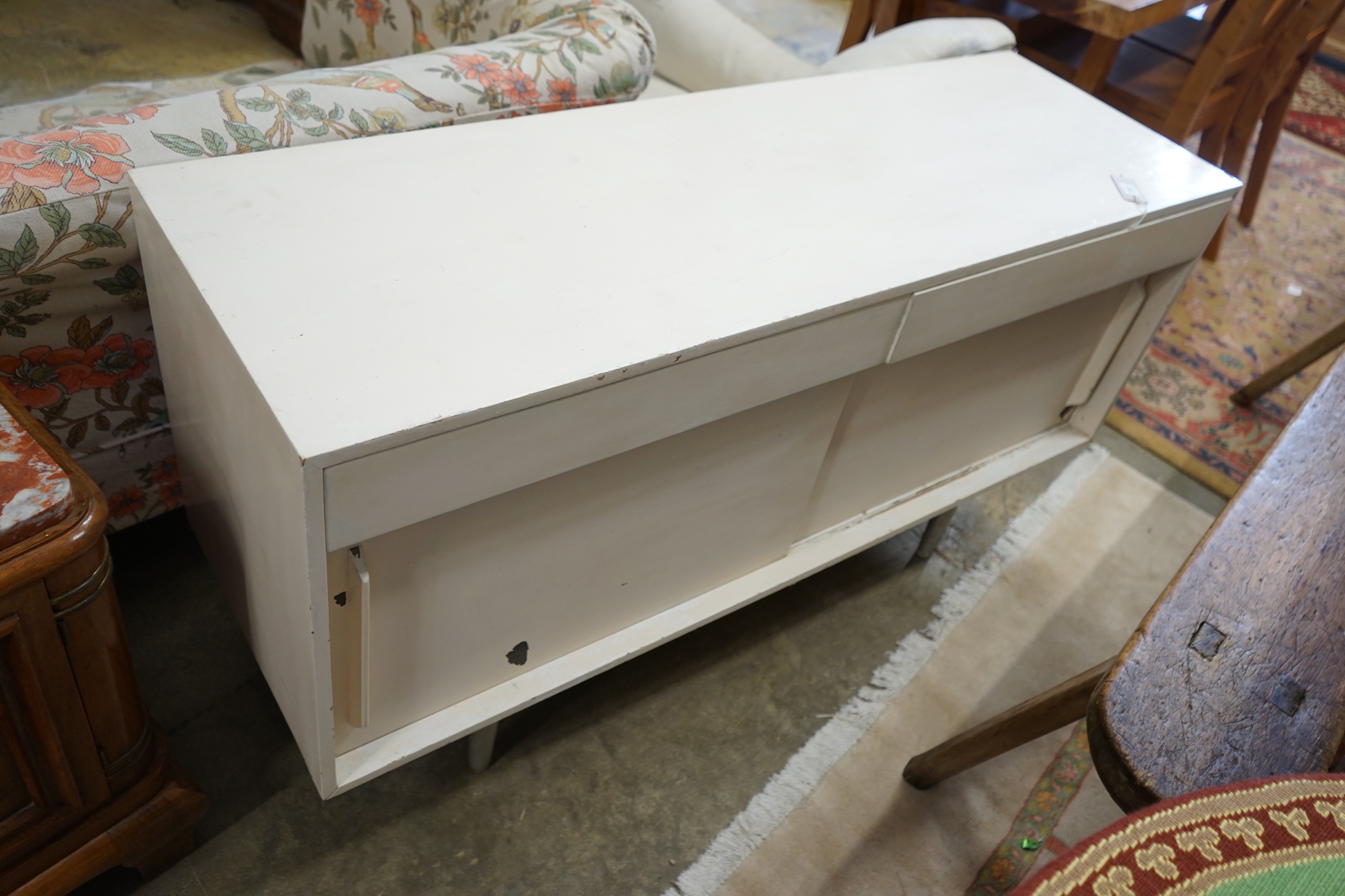 A Robin Day mid century sideboard, later painted, width 137cm, depth 45cm, height 75cm